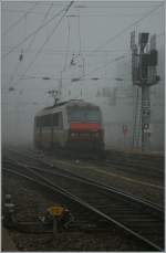 Heavy fog in Strasbourg - SNCF Sybic BB 26160 is coming with the overnight train from the south of French. 
29.10.2011