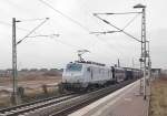 Through the station Allerheiligen near Neuss in the lowerrhinearea the AKIM E37 511 with a bunch of car loaded with gastubes rides southwards to Cologne. Friday 22th of march 2013.