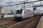 Akiem/Lineas 186 385 hauls a tank train through Antwerpen-Berchem on 14 July 2022.