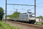 The Hexafret 186 194-7 with an empty flat stake goods wagons train from the port of Antwerp back to France. Bombardier Traxx F140 MS build in 2016 with construction N� 35364. Line 27A at Antwerp Airport. 15-07-2026