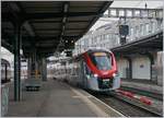 The SNCF Regiolis Z 31 521 on the way to Annemasse is arriving at the Geneva Main Station.