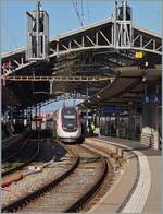 The TGV Lyria 4729 on the way to Paris is leaving the station of Lausanne.