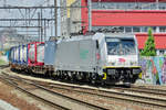 Akiem 186 184 hauls a container train through Antwerpen-Berchem on 29 June 2016.