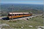 One of the six Chemin de Fer de La Rhune He 2/2 three-phase locomotives is almost at the destination of the journey with its train: at the La Rhune summit station at 905 meters above sea level. 
April 12, 2024