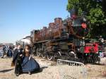 2.670 of the erstwhile Chemins de Fer du NORD used to be in private posession in Britain, but made sort of sensation on it's return to the Continent after having been bought by AJECTA at Longueville. Here the loco with matching stock and travellers stands in Longueville on a sunny 19th of September 2011.