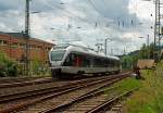 A little Flirt - ET 22 002 (2-piece Stadler Flirt) of the Abellio Rail NRW on 10.07.2012 runs from  Siegen main station to the station Siegen-Geisweid.