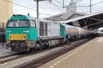 Alpha Trains 1106 -in service of RF- hauls a train of tankwagons through Tilburg on 19 June 2014. 