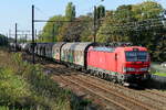 The DB Cargo 193 323 on route from the port of Antwerp to Germany with a mixed train. Siemens Vectron MS build in 2018 with construction N� 22448. Line 27A at Antwerp Airport. 05-10-2026