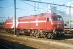Scanned picture shot from the passing train: HGK DE12 in Sittard on 25 July 2001.