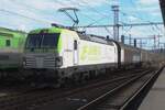 CapTrain/ITL 193 897 hauls a freight through Decin hl.n. when the Sun breaks through on 27 May 2025.