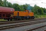 Locomotive 41 (MaK DE 1002) of the Kreisbahn Siegen-Wittgenstein (KSW) at the 08.07.2011 in Herdorf goes on with a freight train. From the KSW own yard, it then goes onto the DB-track in direction of Betzdorf.