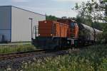 Locomotive 41 (MaK DE 1002) of the Kreisbahn Siegen-Wittgenstein (KSW) runs on 05.07.2011 in Neinkirchen-Struthtten with a freight train (loaded with coils) on the own rail tracks from the KSW, in