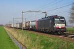 MRCE X4E-660 hauls an intermodal service through Hulten on 5 April 2023.