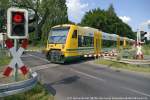 Ahrensfelde, Levelcrossing Lindenberger Strae,  ODEG  Regio-Shuttle RS 1 VT 650.82 (95 80 0650 082-0 D-ODEG)  Stadt Knigs Wusterhausen  as OE 25 with the 14,39 train from Berlin Lichtenberg to Werneuchen. 29th August 2012