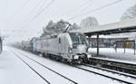 While hardsnowfalls the german railpool 193 817-4 waiting with a bunch of tankcars in it's back at the station of Rheydt central to get a green signal for leaving to cologne at sunday the 10th of Dezembre 2017