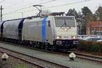 On a grey 18 December 2019, RailPool 186 551 enters Oss with a cereals train.