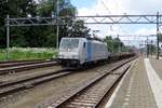 Lineas 186 291 hauls an almost empty Volvo container train toward Antwerp through Dordrecht on 28 June 2020.