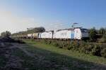 Lineas 186 294 hauls a tank train through Tilburg-Reeshof as the Sun is about to set on 15 October 2021.