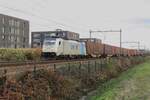 Lineas 186 296 hauls the Volvo-Container train through Tilburg-Reeshof toward Antwerpen on 8 December 2021.
