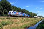 RTB 186 300 'ANTWERPEN' hauls an intermodal train through Tilburg Oude Warande on 24 June 2020.