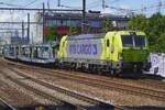 RTB Cargo 193 115 hauls an empty car transport train through Antwerpen-Berchem on 3 July 2026.