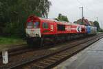 On a very wet and rainy 2 June 2013 HGK DE 668 stands in Grosskorbetha.