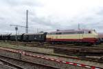 Ex-DB 218 105 hauls a set of 'Donnerbuchsen' out of the DGEG-Museum's  area at Darmstadt-Kranichstein on 30 May 2014.