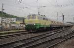 It has begun to rain on 28 April 2018 at Trier Hbf when Brohltalbahn 218 396 hauls the extra train out of the oldest city in Germany toward Koblenz.