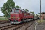 Arnstadter ex-DR Taiga Drum 120 274 hauls some ReKo coaches through the massive area of the Heizhaus Chemnitz-Hilbersdorf on a grey 22 August 2026. The ReKociaches were reconswtructed coaches frombefore WW-2 that could be rebuild speedily to cover fo ...