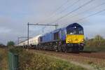 Railtraxx 266 11 3thunders through Tilburg-Reeshof hauling an LNG train on 11 NOvember 2022.