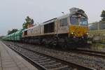 EuroCargoRail 247 026 takes a break in Tüssling with her coal train on a drizzly 13 September 2024.