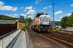KSW 46 (also designated 277 807-4 / 92 80 1277 807-4 D-KSW)—a Vossloh G 1700-2 BB locomotive operated by KSW (Kreisbahn Siegen-Wittgenstein)—is shown passing through Kirchen/Sieg on June 18, 2026, hauling a loaded coil train towards Herdorf. The locomotive is required to run around the train in Betzdorf/Sieg to change direction.
