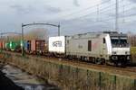 RheinCargo DE 804 hauls a partially filled container train through Tilburg-Reeshof on 24 January 2021.