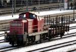 294 869-3 and goods wagon Rlmmso 58 at Ulm, December 22nd, 2009.
