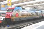DB 101 087 advertises for a vacation in South-Africa at München Hbf on 25 May 2012, where it was photographed by someone, who decided to go to Austria instead. 