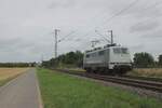 Rail Adventure 111 082 rides solo through Kaarst Broicherseite on a grey 8 August 2025.