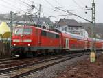 It is again driven Sandwich: The RE 9 (Rhein-Sieg-Express) Aachen - Cologne - Siegen, has left here at the station 08.01.2012 Betzdorf / Sieg and continue towards Siegen. Front pulls lok 111 010, and pushes behind locomotive 111075-8.