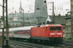 Seen from Köln Hansaring, DB 112 180 hauls an Interregio out of Köln Hbf on 17 July 2000.