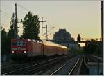 The DB 114 027-6 with a RE1 on the Statdbahn by the  Hackscher Markt .