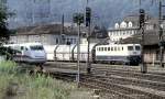 139 222-4 is helping a goods train to reach the hill of Geislinger Steige by pushing; an ICE 1 is coming out of Geislingen station, August 15th, 1997.