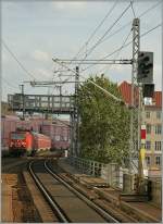 A DB 143 with a local train is arriving at Berlin Alexander Platz.