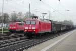 On a grey 9 April 2014, DB 145 004 hauls a freight train through Minden (Westfalen).