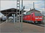 The DB 146 230-8 with an RE to Basel by his stop in Müllheim (Baden), in the background the conecting service to Mulhouse.