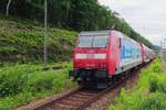 On a damp 9 June 2022 DB 146 017 pushes a suburban train out of Bad Schandau.