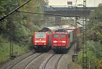 Meeting of 146 217-5 with double-floor wagons and 151 148-4 by pushing service a heavy goods train at Geislinger Steige, at September 25th, 2010.