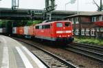 Scanned picture of 151 145 passing Hamburg-Harburg hauling one of the very, very many container trains that pass through this station. Seen on 24 May 2004.