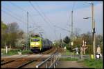 152 005-5 of DB Schenker Rail (advertising for Claas) with a container train in Dresden-Stetzsch. (2012-04-20)  