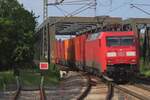 On 2 May 2024 DBC 152 016 comes off the bridge at Celle toward Hannover.