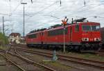 Two on 30.04.2012 in Kreuztal parked locomotives BR 155 (ex DR 250) of DB Schenker Rail (155180-3 and 155154-8 behind). Behind the signal box Kreuztal North (Kn).