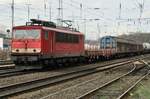 On 21 March 2017 ex-DR 155 055 hauls a mixed freight through Duisburg-Entenfang.